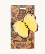 The Oli & Carol Natural Rubber Teether - Katia The Butterfly on its cardboard packing slip on a cream background
