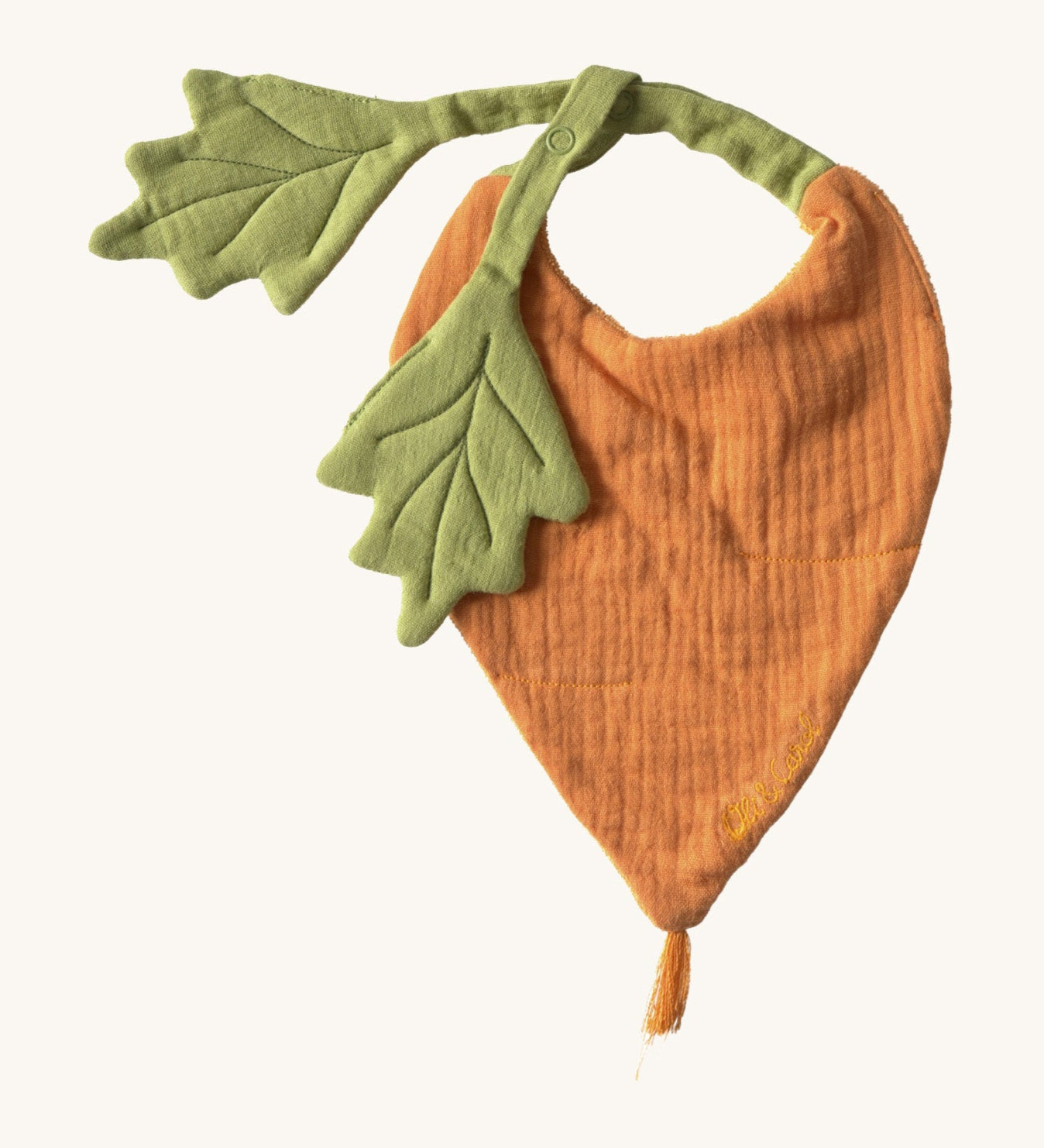 Oli & Carol Cathy the carrot baby bib available at Babipur. A organic cotton bib in a shape of a orange carrot  Features a popper fastener. 