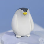 Oli & Carol Penguin Bath Toy Set on a blue background