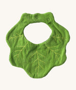 The reverse side of the Oli & Carol Kendall the kale baby bib available at Babipur. A organic cotton bib in a shape of green kale. Features a popper fastener for size adjustment. 