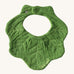 Oli & Carol Kendal the kale baby bib available at Babipur. A organic cotton bib in a shape of green kale. Features a popper fastener. 