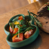A close up of food on the Oli & Carol Kendall the Kale wooden plate and spoon set available at Babipur.