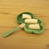 A close up of the Oli & Carol wooden leek spoon from the kale and leek set available at Babipur.