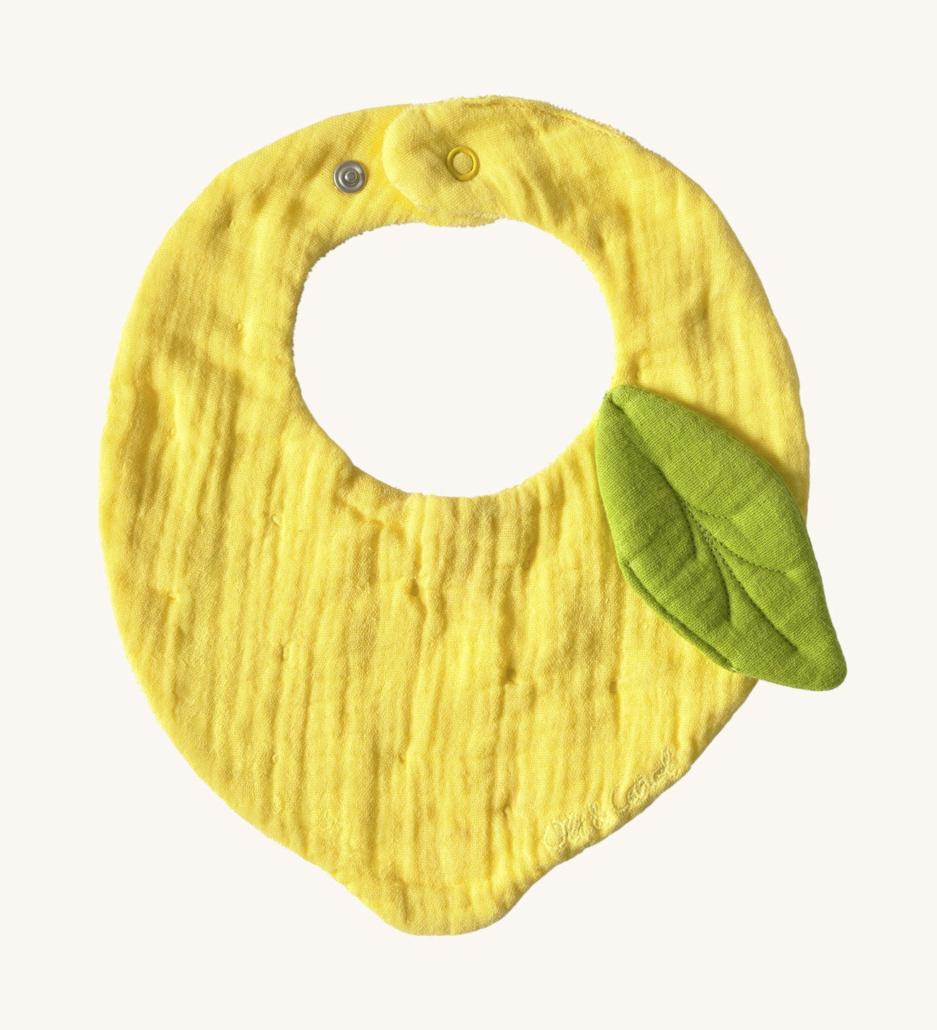 Oli & Carol Lou the lemon baby bib available at Babipur. A organic cotton bib in a shape of a yellow lemon. Features a popper fastener. 