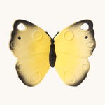 The Oli & Carol Natural Rubber Teether - Katia The Butterfly, showing a yellow natural rubber teether on a cream background
