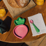 Oli & Carol Ramona the radish wooden plate and spoon set available at Babipur on a wooden table in a meal time setting.