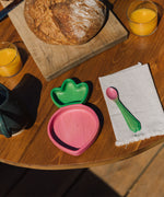 Oli & Carol Ramona the radish wooden plate and spoon set available at Babipur on a wooden table in a meal time setting.