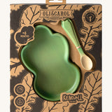 A close up of the cardboard packaging holding the Oli & Carol Kendall the Kale wooden plate and spoon set available at Babipur. 