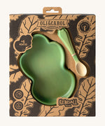 A close up of the cardboard packaging holding the Oli & Carol Kendall the Kale wooden plate and spoon set available at Babipur. 