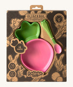 A close up of the cardboard packaging holding the Oli & Carol Ramona the radish wooden plate and spoon set available at Babipur. 