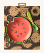 A close up of the cardboard packaging holding the Oli & Carol Wally the watermelon wooden plate and spoon set available at Babipur. 