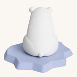 The back of the Oli & Carol Polar Bear Bath Toy showing a little polar bear tail and the texture of the natural rubber. On a cream background