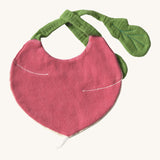 The reverse side of the Oli & Carol Ramona the radish baby bib available at Babipur. A organic cotton bib in a shape radish. Features a popper fastener for size adjustment. 