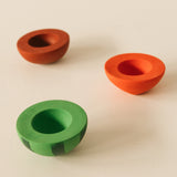 A image showing one half of the watermelon, cherry and apple Oli & Carol stacking toy rattle balls available at Babipur.