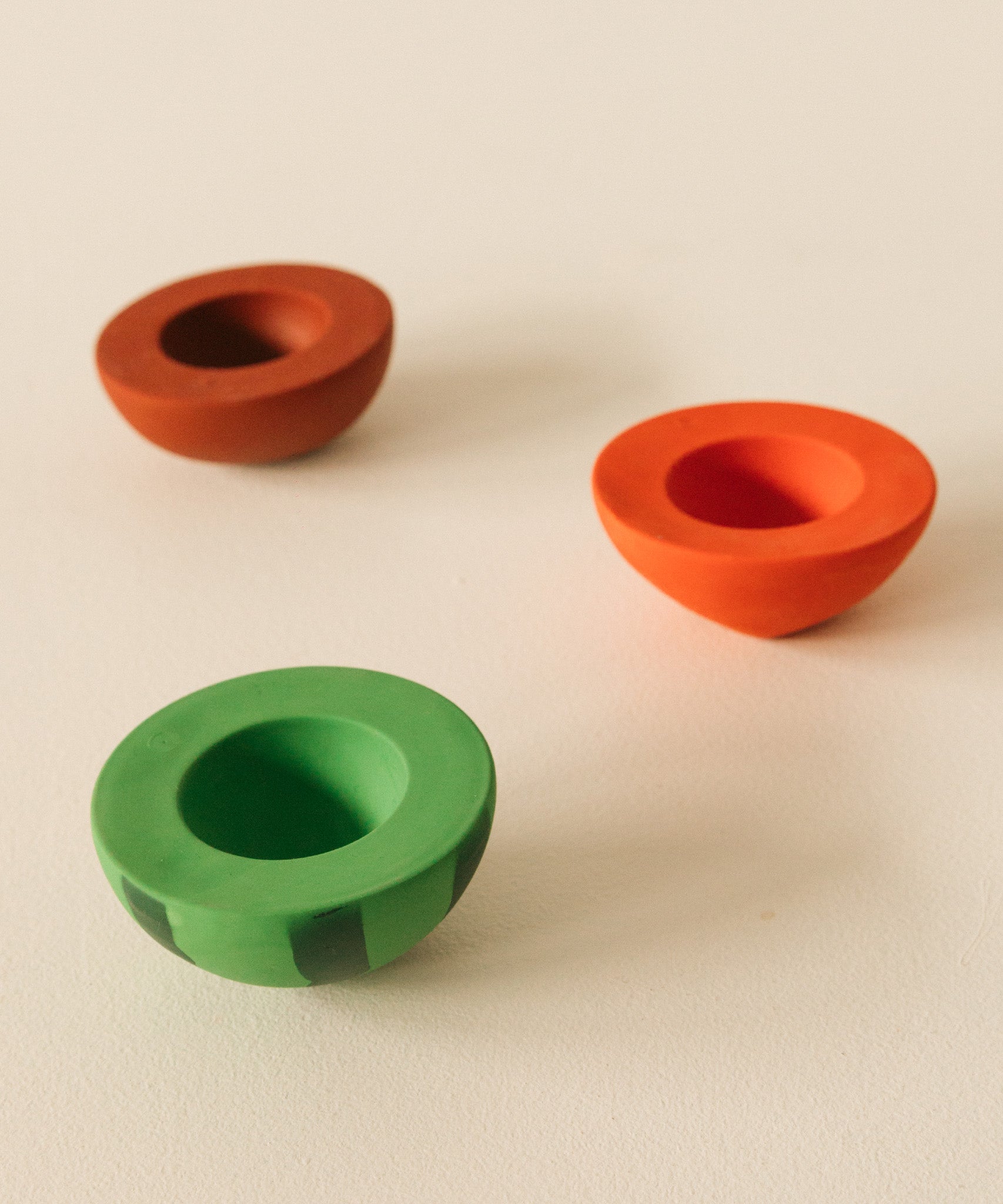 A image showing one half of the watermelon, cherry and apple Oli & Carol stacking toy rattle balls available at Babipur.