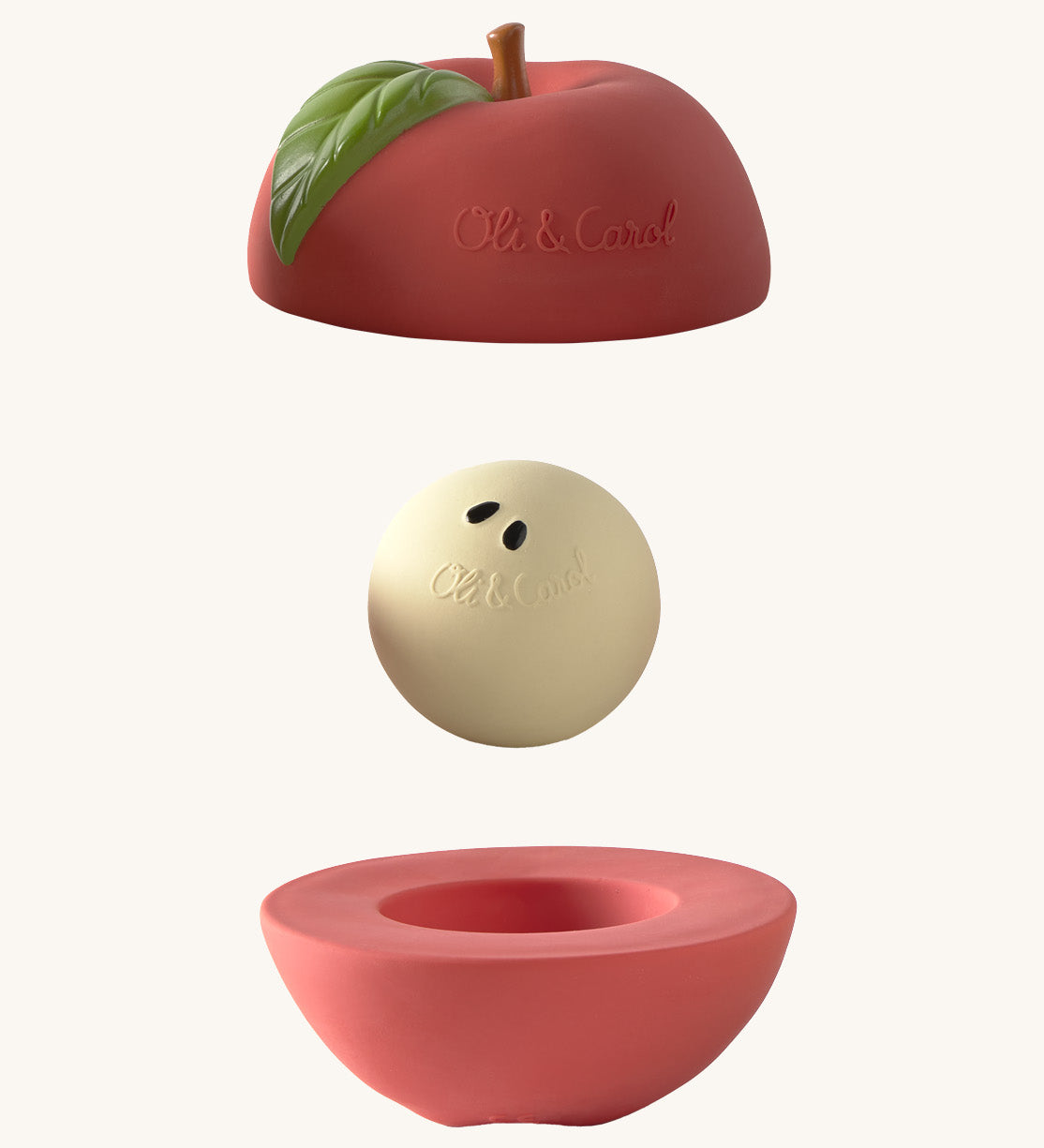 Oli & Carol red apple stacking toy rattle ball available at Babipur. Showing the 2 halves with the core. 