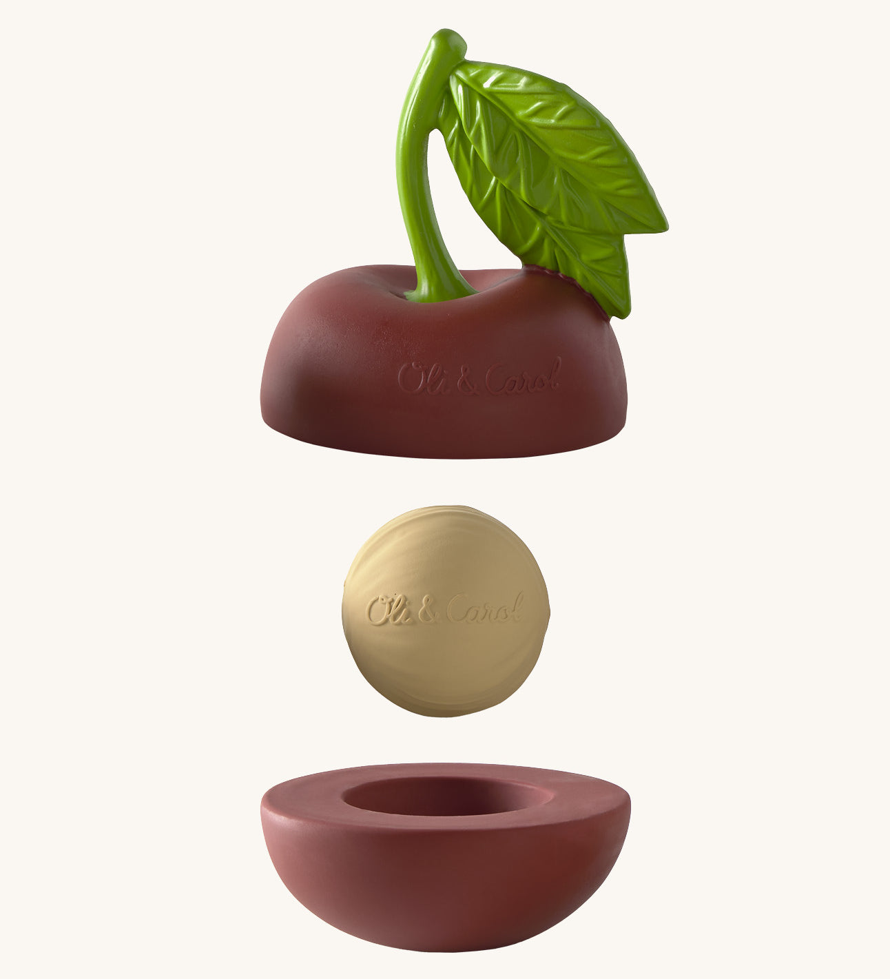 Oli & Carol cherry stacking toy rattle ball available at Babipur. Showing the 2 halves with the core. 