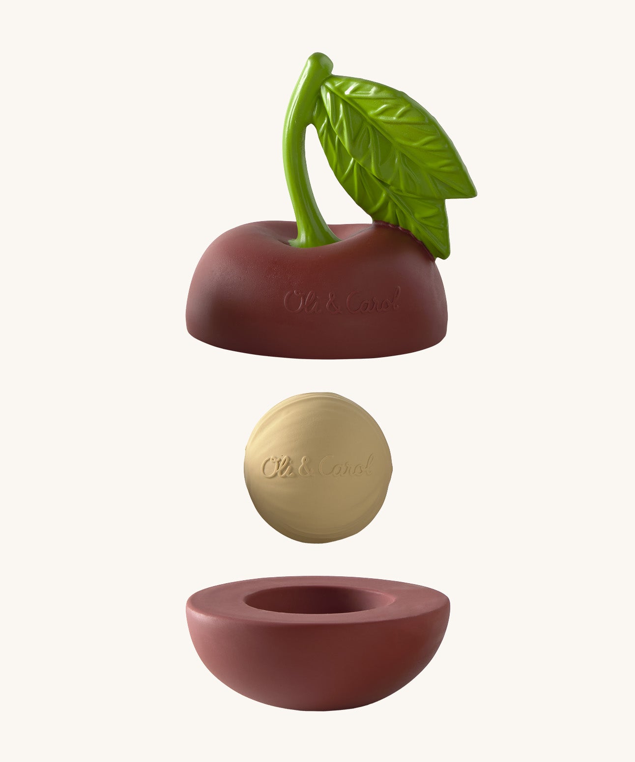 Oli & Carol cherry stacking toy rattle ball available at Babipur. Showing the 2 halves with the core. 