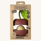 The front of the cardboard packaging holding the Oli & Carol cherry stacking toy rattle ball available at Babipur. 