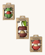 The front of the cardboard packaging holding the Oli & Carol red apple , cherry and watermelon stacking toy rattle balls  available at Babipur. 