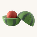 A opened Oli & Carol watermelon stacking toy rattle ball available at Babipur. Showing the 2 halves with the core. 