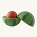 A opened Oli & Carol watermelon stacking toy rattle ball available at Babipur. Showing the 2 halves with the core. 