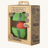 The side of the cardboard packaging holding the Oli & Carol watermelon stacking toy rattle ball available at Babipur. 
