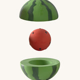 Oli & Carol watermelon stacking toy rattle ball available at Babipur. Showing the 2 halves with the core. 
