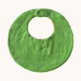 The reverse side of the Oli & Carol Wally the watermelon baby bib available at Babipur. A organic cotton bib in a shape of a watermelon cut in half. Features a popper fastener for size adjustment. 