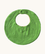 The reverse side of the Oli & Carol Wally the watermelon baby bib available at Babipur. A organic cotton bib in a shape of a watermelon cut in half. Features a popper fastener for size adjustment. 