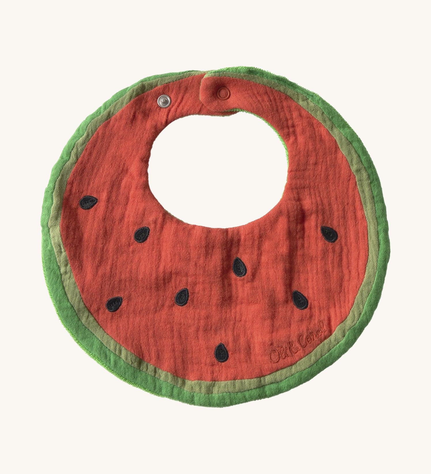 Oli & Carol Wally the watermelon baby bib available at Babipur. A organic cotton bib in a shape of a watermelon cut in half. Features a popper fastener. 