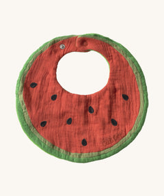 Oli & Carol Wally the watermelon baby bib available at Babipur. A organic cotton bib in a shape of a watermelon cut in half. Features a popper fastener. 