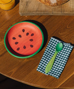 Oli & Carol Wally the watermelon wooden plate and spoon on a table set available at Babipur. 