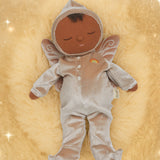 Olli Ella Ada fairy dozy dinkum doll lying on a soft brown surface. 