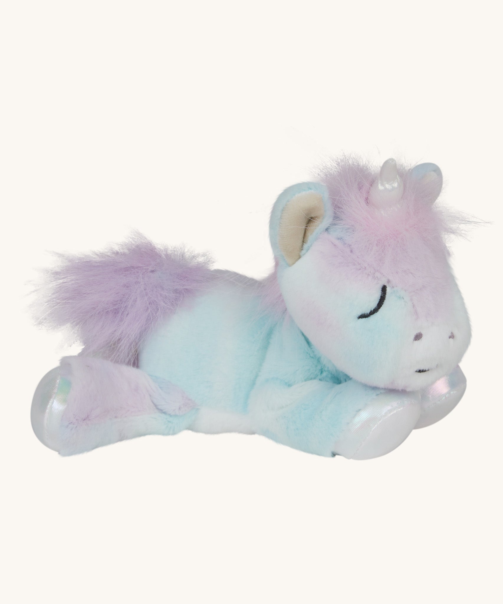 A posing Olli Ella baby binky unicorn dinkum. A soft and cuddly doll in light pastel colours. Features a white unicorn horn and light purple hair