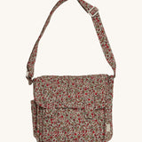 The Olli Ella Carrie Convertible Changing Set in Garland, which is a beautiful, vintage floral print on a cream background