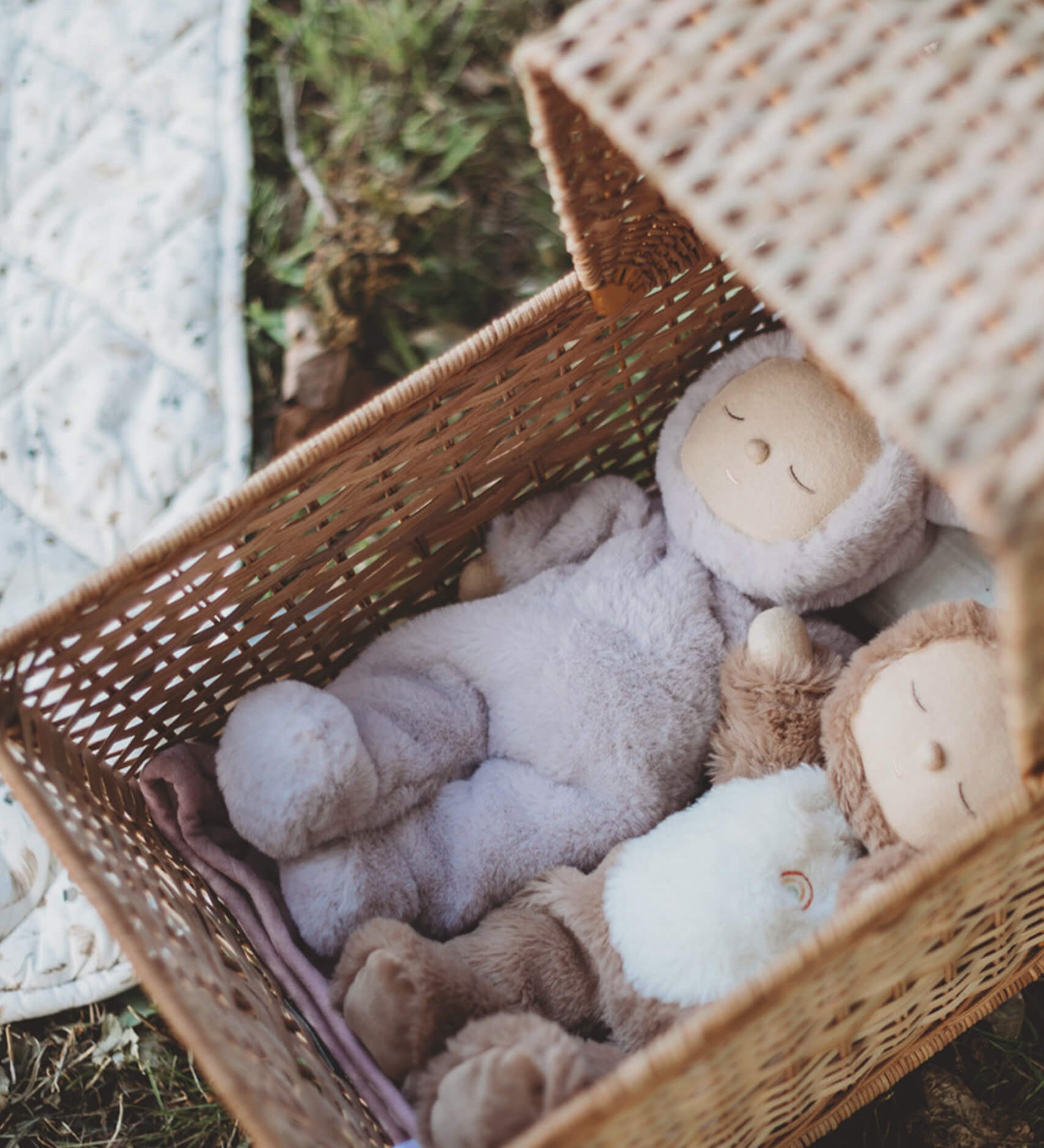 A Olli Ella cozy dinkum bunny twinkle doll lying in a Olli Ella strolley. This fluffy toy doll is available at Babipur.