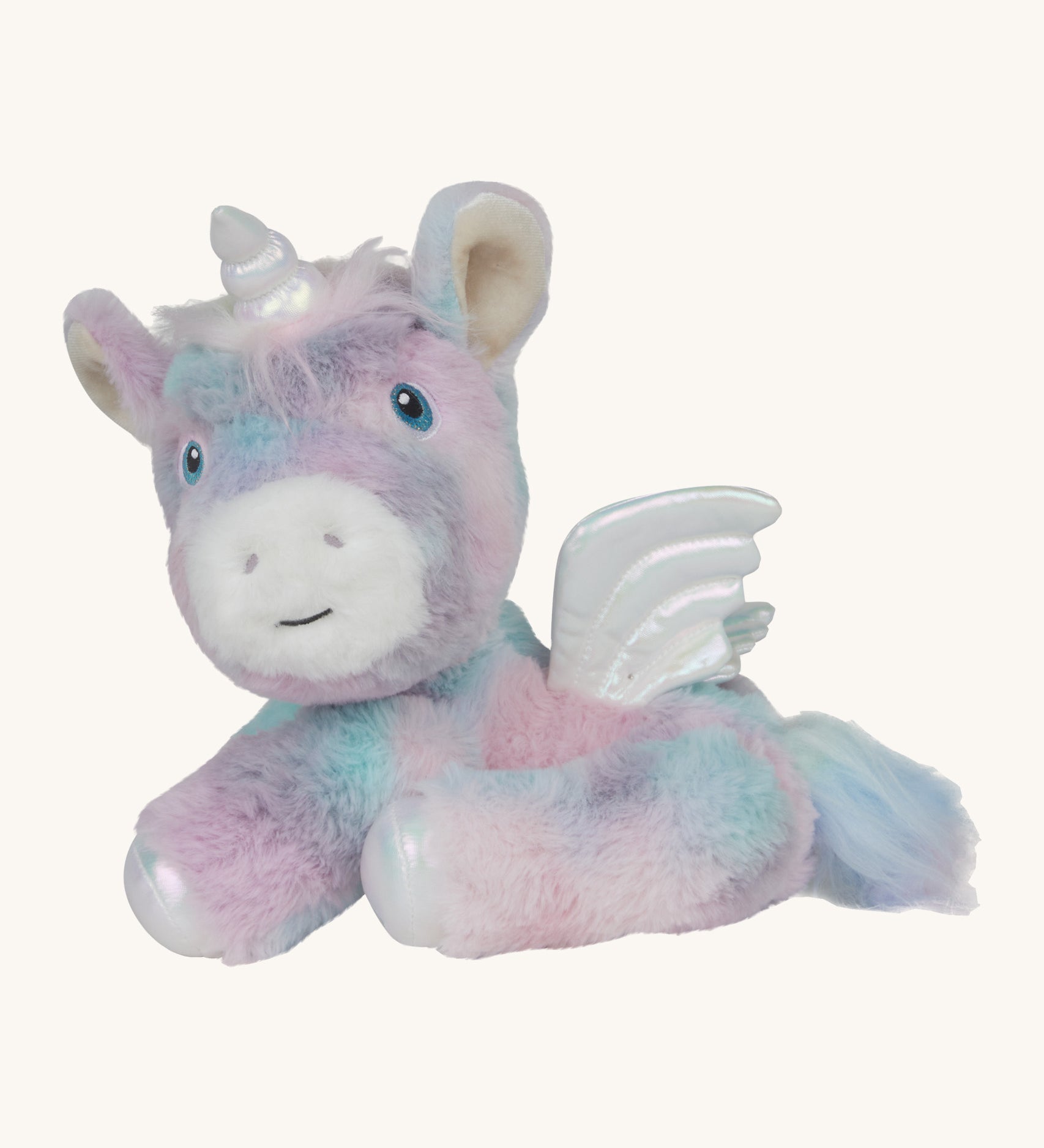 A posing  Olli Ella dazzle unicorn dinkum. A soft and cuddly doll in light pastel colours. Features white pegasus wings and a unicorn horn