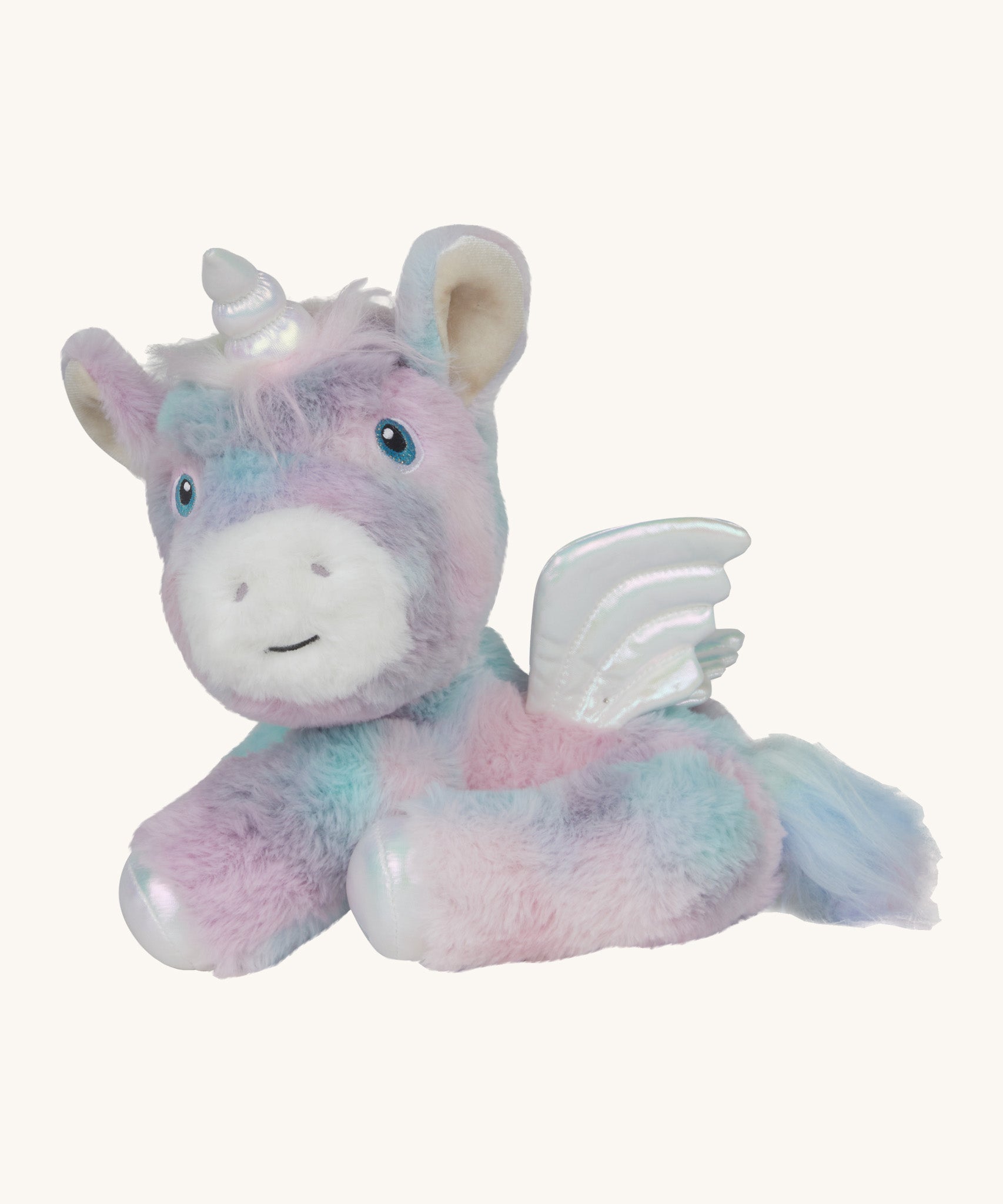 A posing  Olli Ella dazzle unicorn dinkum. A soft and cuddly doll in light pastel colours. Features white pegasus wings and a unicorn horn