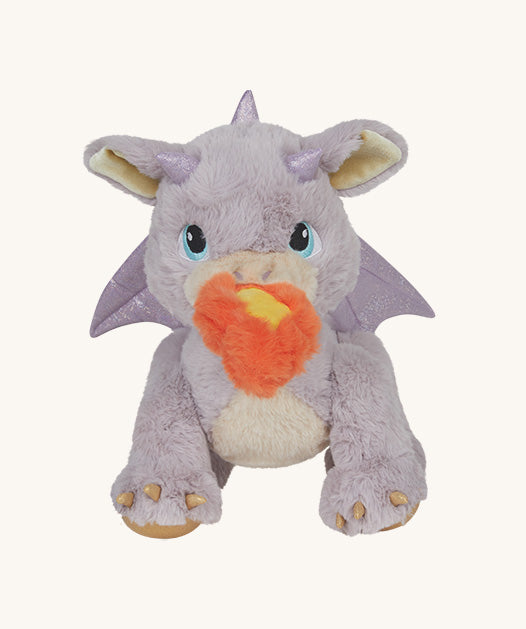 A Olli Ella dinkum dragon flare doll  This light pink fluffy doll has movable limbs and features pink glittery wings and comes with a magnetic fluffy fire piece. This doll is available at Babipur.