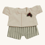 Olli Ella Dinkum Doll Holiday Outfit Set come with two adorable pieces, a set of dungarees with a green and cream patterned print, and a cream cardigan with a holly berry and leaf applique. The perfect outfit for any Dinkum Doll this Christmas! The image is on a cream background.