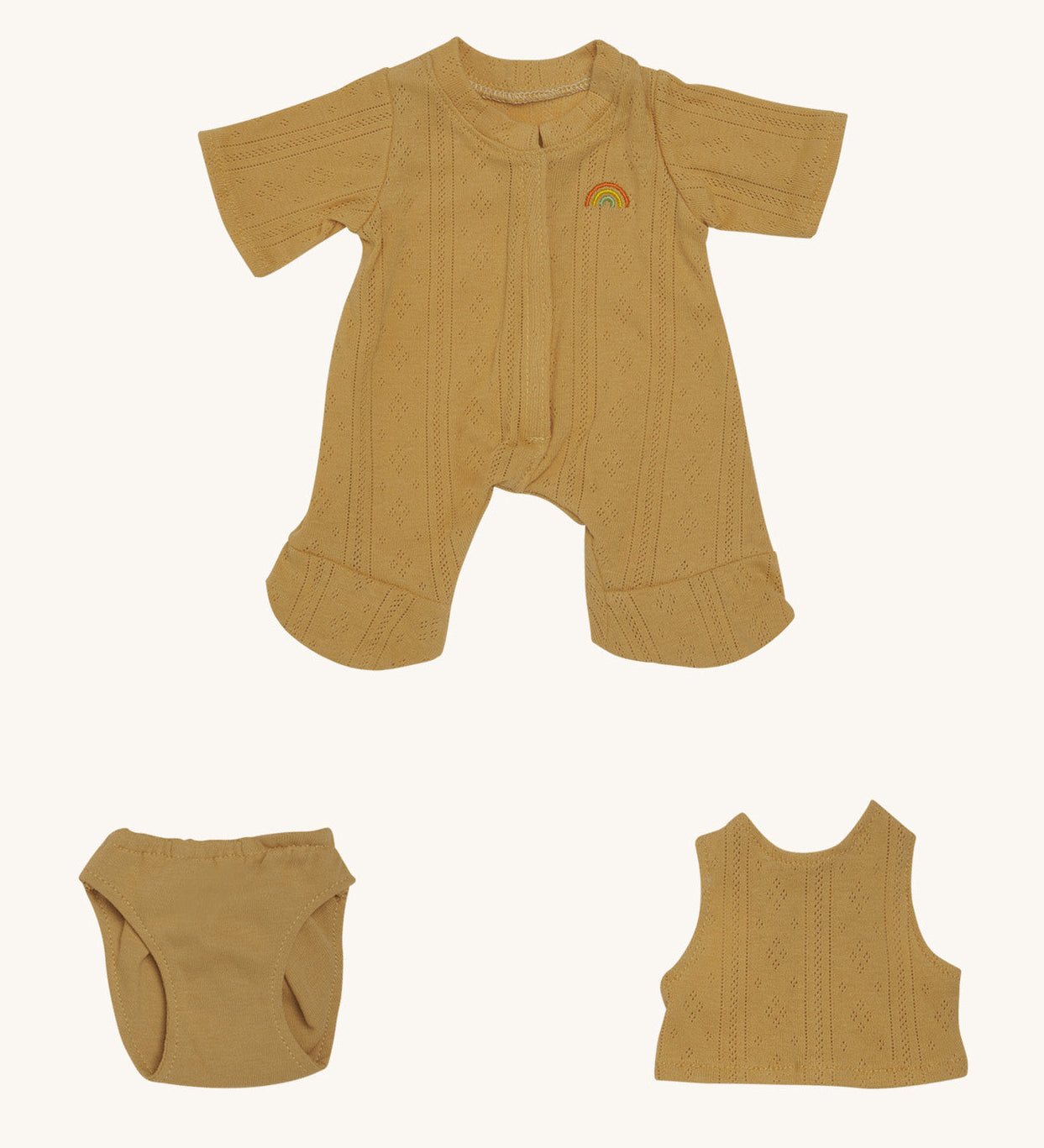 Olli Ella Dinkum Doll pointelle pyjama set in honey colour, available at Babipur. This set includes a onesie, a vest and underwear. This set can be used on a Olli Ella dinkum doll.