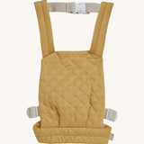 Olli Ella quilted toy carrier in honey available at Babipur. This dark yellow  toy carrier features a buckle on the back and side for a secured fit and can carry a Olli Ella diknum doll