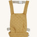 Olli Ella quilted toy carrier in honey available at Babipur. This dark yellow  toy carrier features a buckle on the back and side for a secured fit and can carry a Olli Ella diknum doll