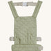 Olli Ella quilted toy carrier in sage available at Babipur. This pastel green toy carrier features a buckle on the back and side for a secured fit and can carry a Olli Ella diknum doll
