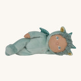 Olli Ella Dante the dragon dinky dinkum doll lying down. A pale green doll with matching curly hair and cute ears. 
