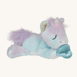 A posing Olli Ella baby binky unicorn dinkum. A soft and cuddly doll in light pastel colours. Features a white unicorn horn, light purple hair and a blue magnetic pacifier that can be put on the mouth