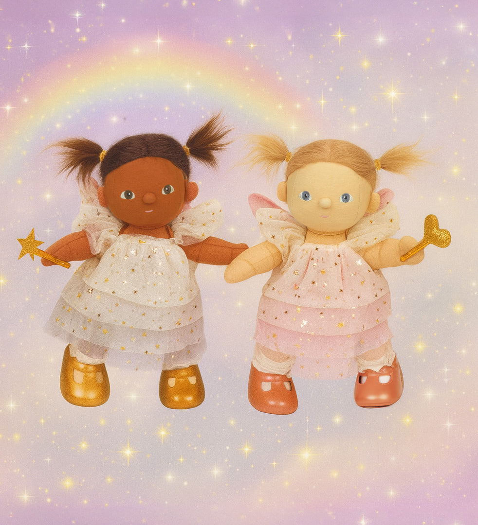 Olle Ella Willow and Freya dinkum dolls standing next to eachother against a dreamy rainbow background available at Babipur.