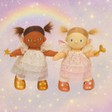 Olle Ella Willow and Freya dinkum dolls standing next to eachother against a dreamy rainbow background available at Babipur.