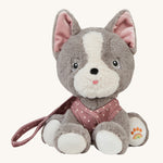 Olli Ella Dinkum Dog - Gizmo is wearing their dark pink with white spotted harness, and is sitting down like a good dog